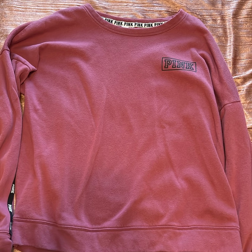 2 PINK crew necks. Both are size small.